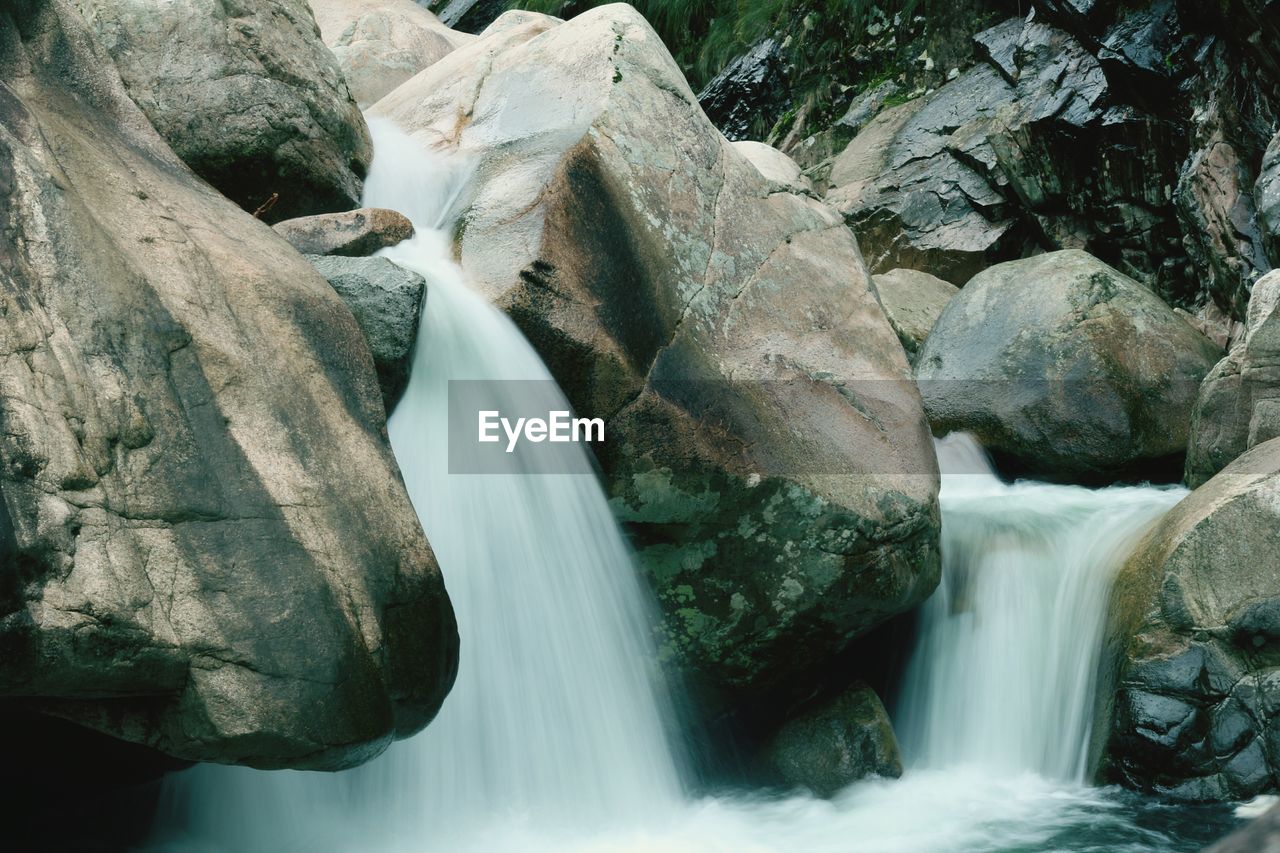 High angle view of waterfall flowing through rocks