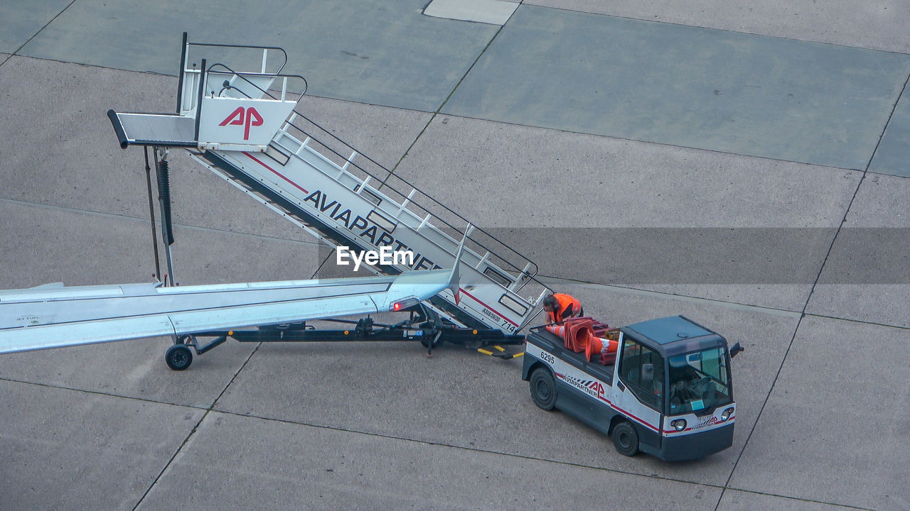 HIGH ANGLE VIEW OF HELICOPTER ON AIRPORT