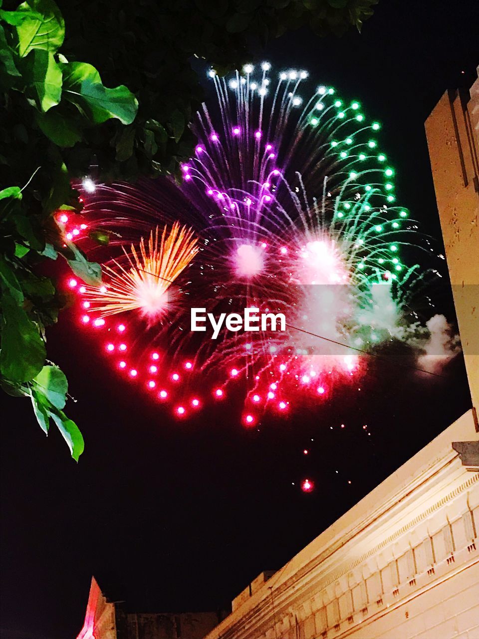 LOW ANGLE VIEW OF FIREWORK DISPLAY