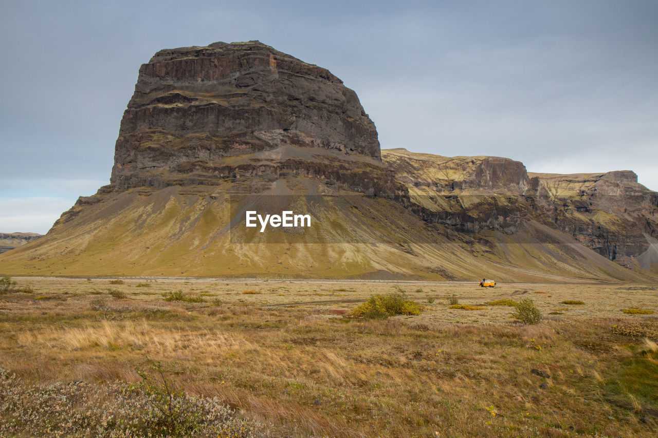 Rock formations on landscape against sky