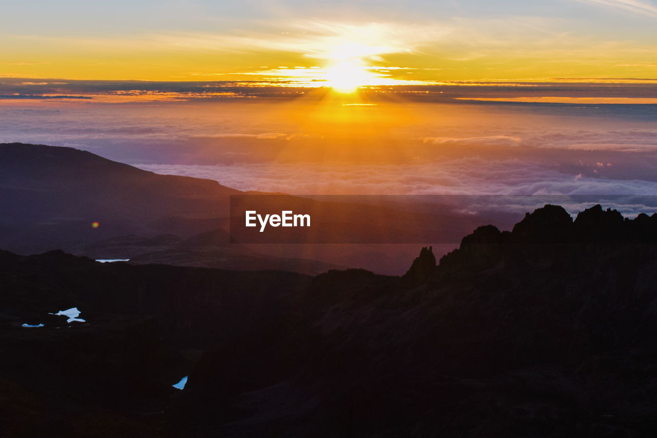 Sunrise above the clouds at at point lenana, mount kenya national park, kenya