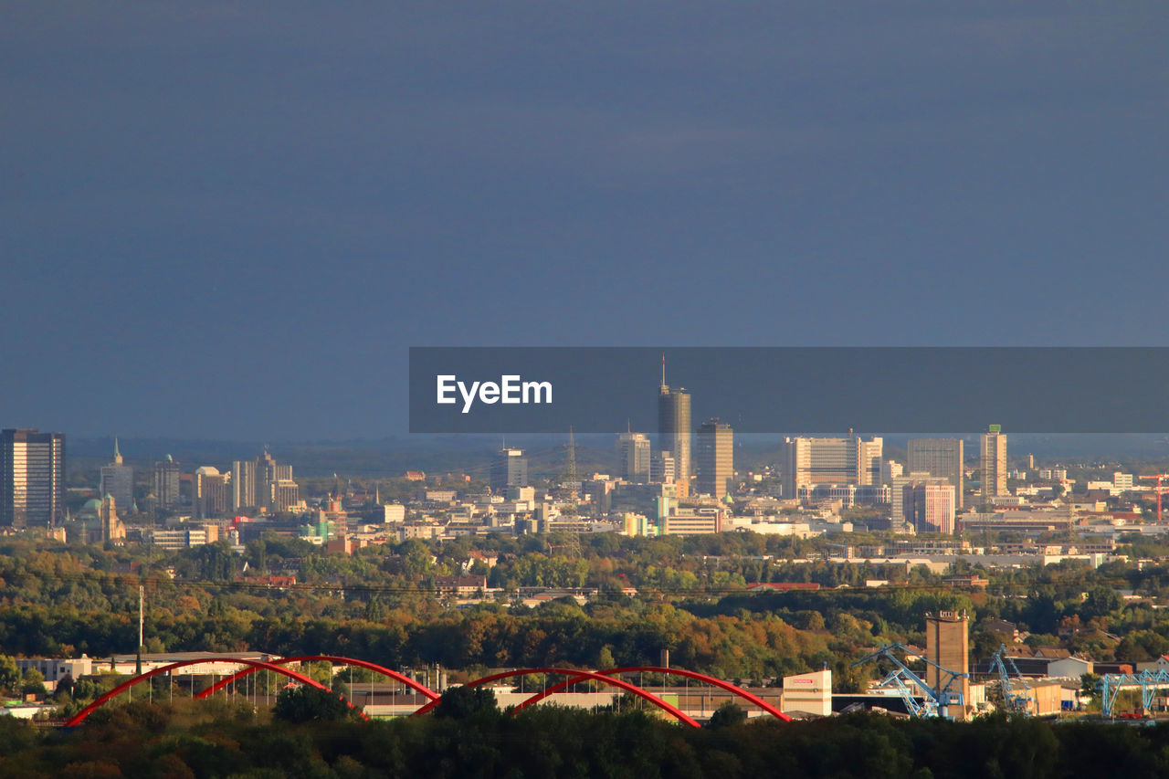 Modern buildings in city against clear sky