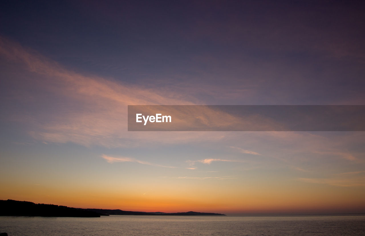 SCENIC VIEW OF SEA DURING SUNSET