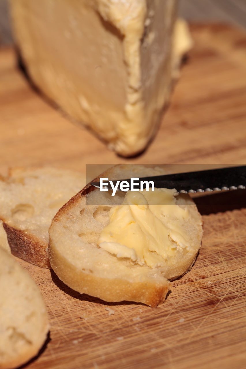 Close-up of bread with cheese on wooden table