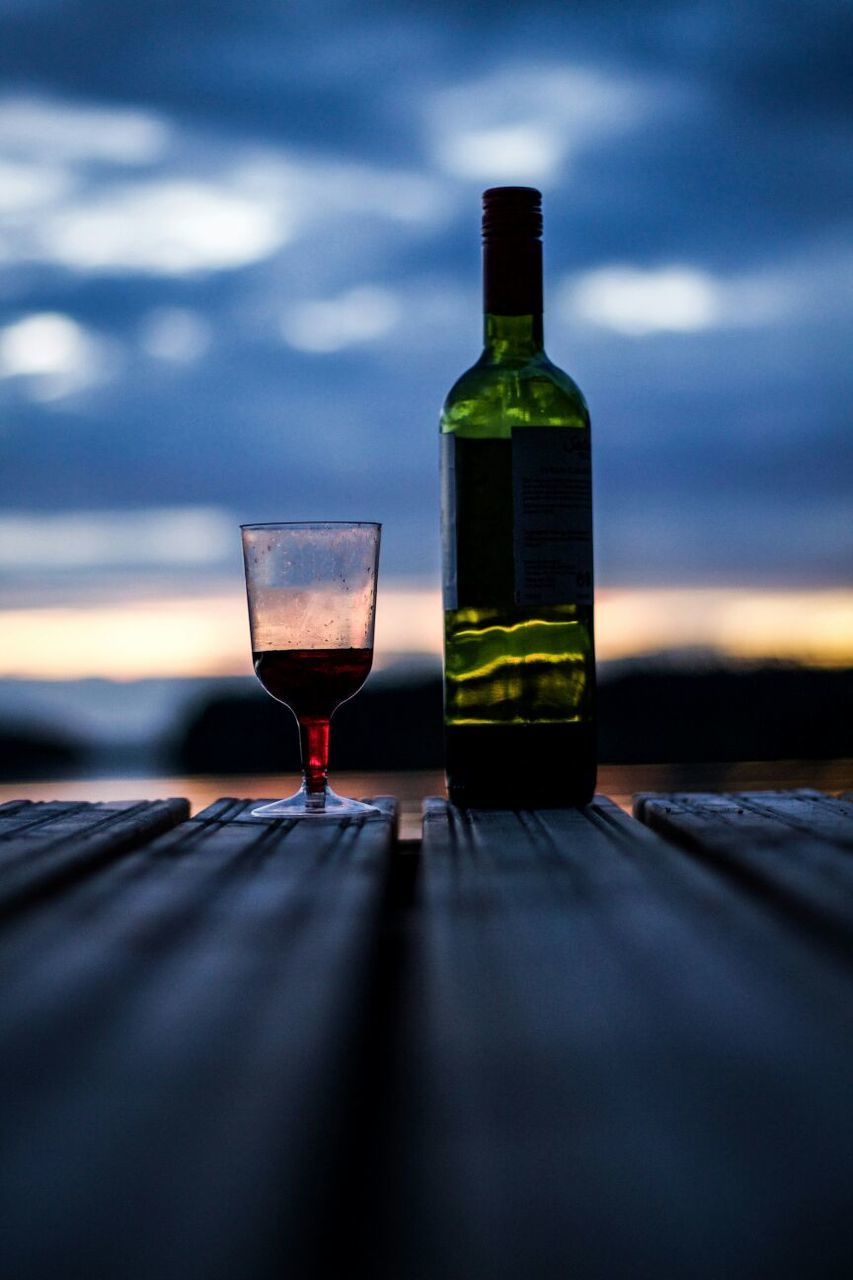 Close-up of wine bottle and glass on table