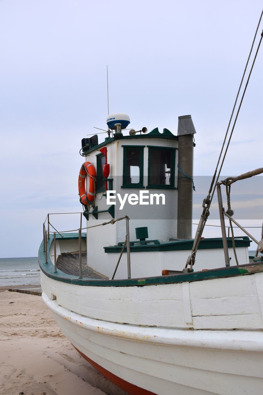 water, nautical vessel, transportation, sea, mode of transportation, beach, boat, vehicle, sky, nature, land, ship, travel, watercraft, no people, holiday, vacation, outdoors, trip, day, coastline, coast, trawler, travel destinations, moored, skiff, fishing industry, fishing, environment