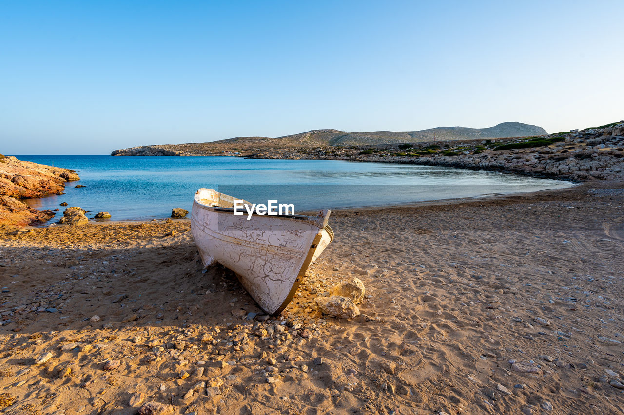 scenic view of beach against clear blue sky