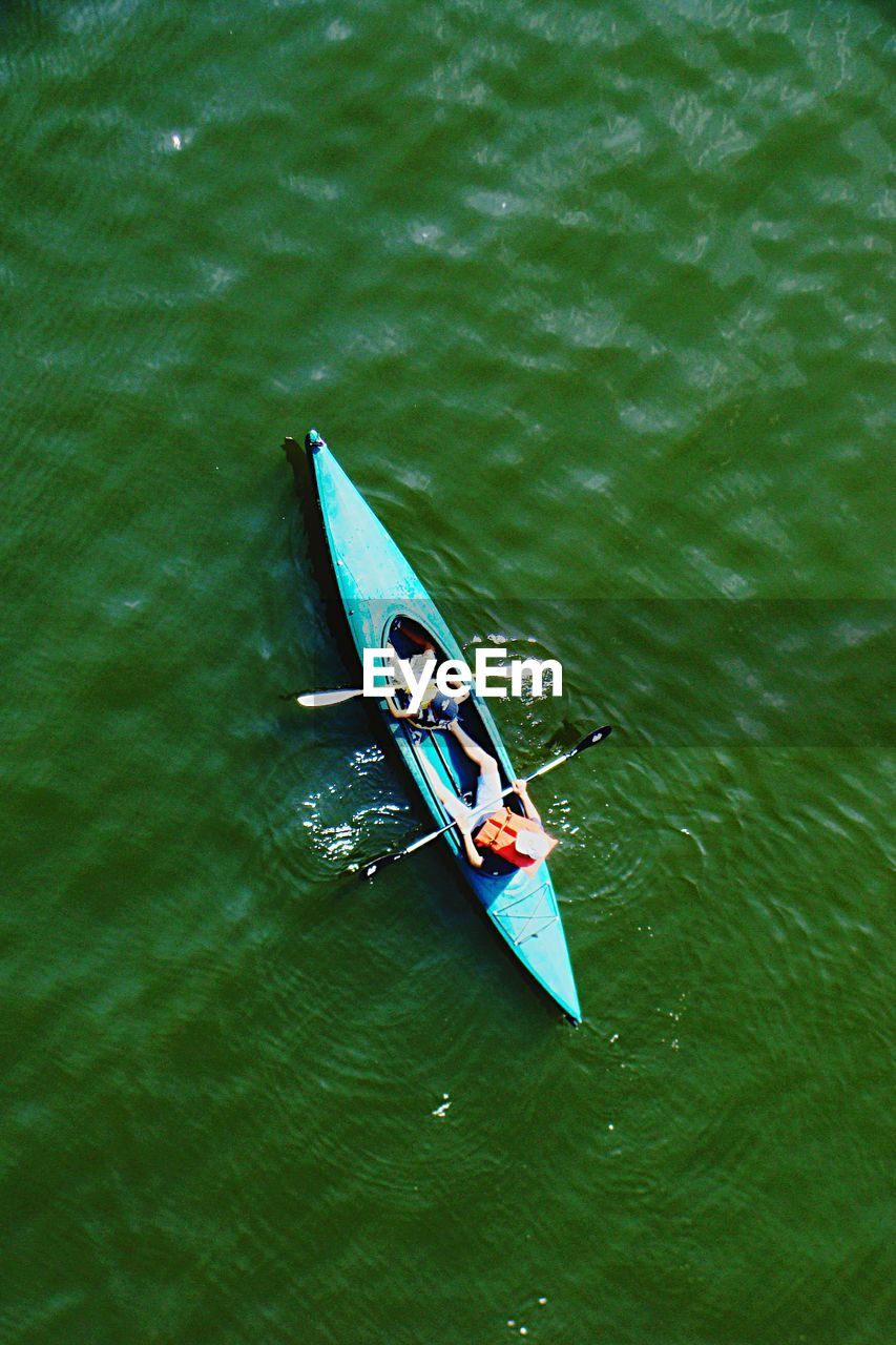 High angle view of people canoeing in lake