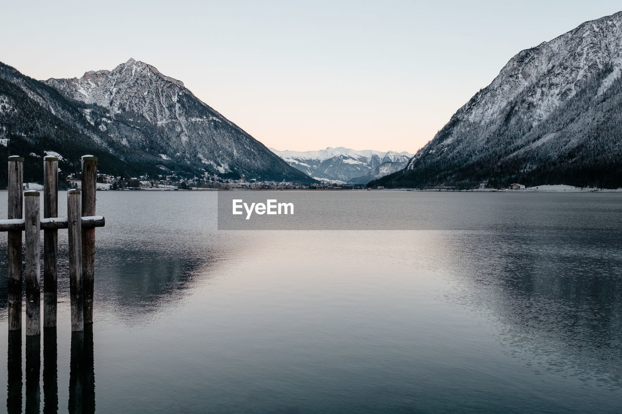 SCENIC VIEW OF LAKE AND SNOWCAPPED MOUNTAINS AGAINST SKY