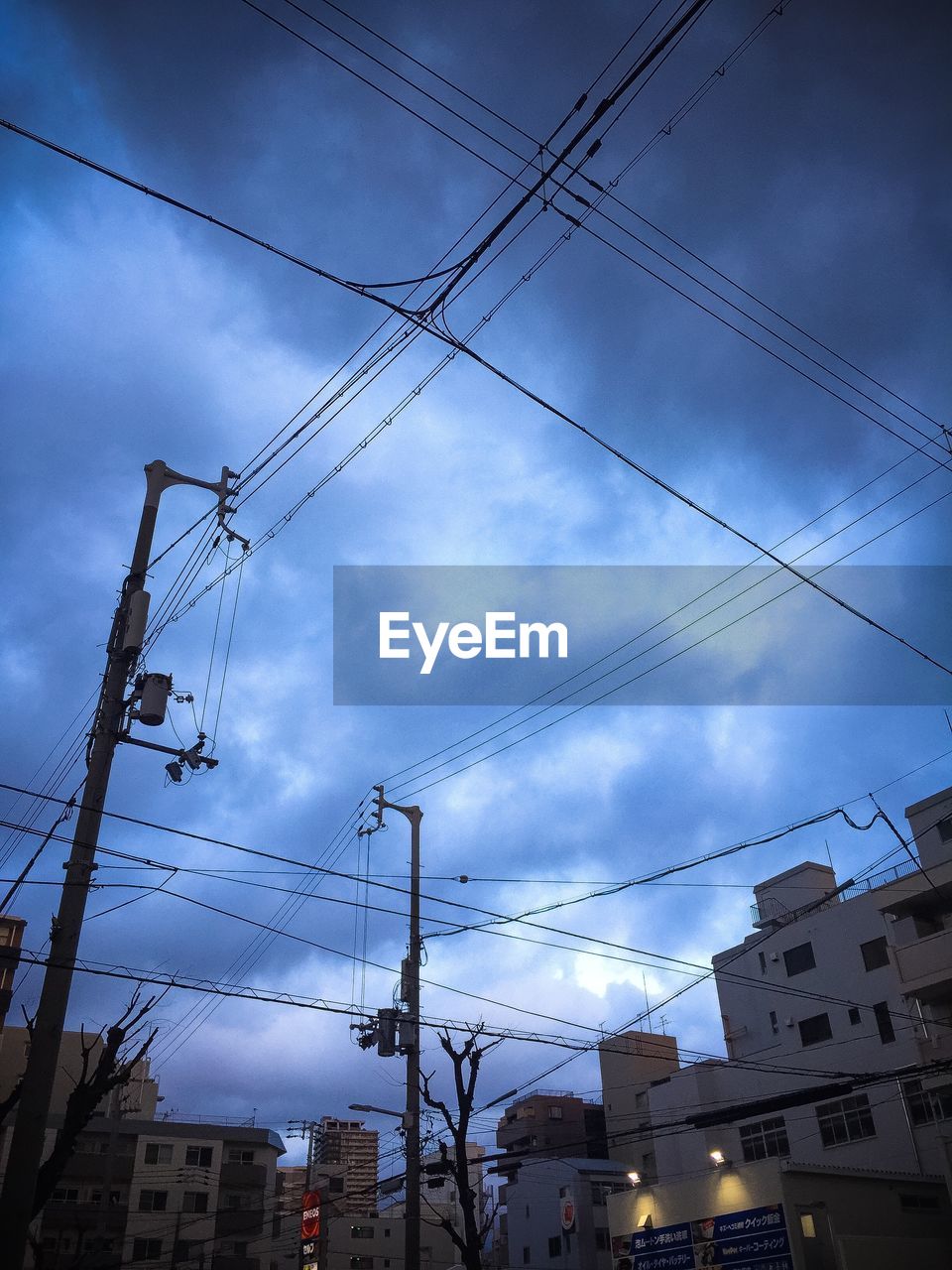 LOW ANGLE VIEW OF POWER LINES AGAINST SKY