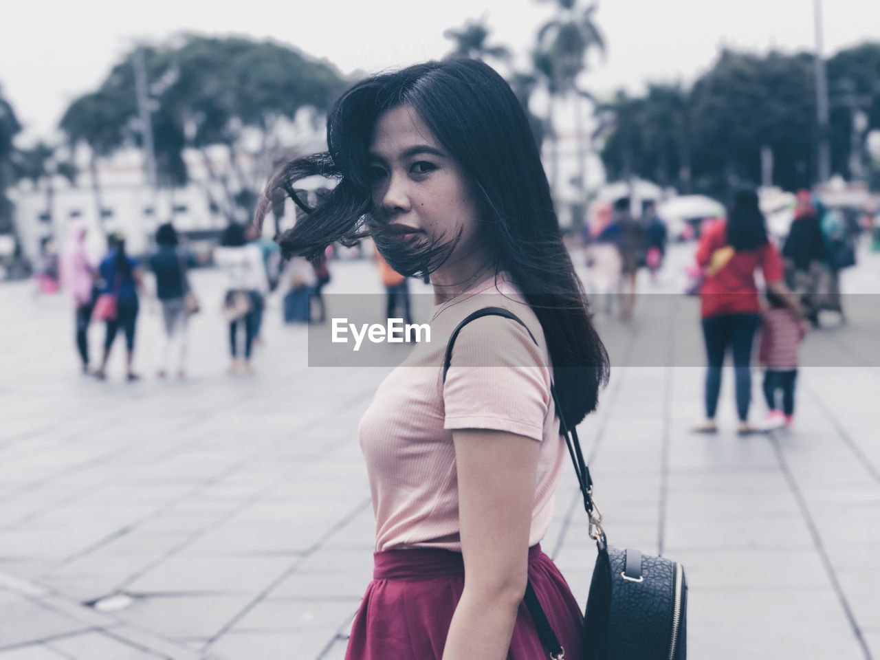 Portrait of young woman walking outdoors