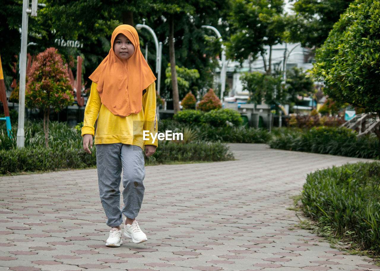 A little girl with a sweet smile, in jayawijaya park.