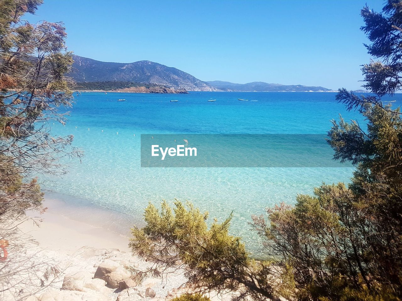 Scenic view of sea against clear blue sky