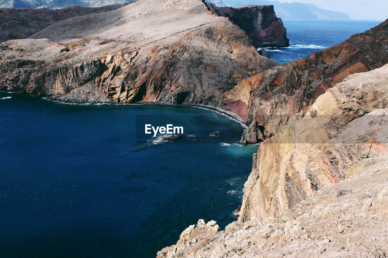 HIGH ANGLE VIEW OF SEA AND MOUNTAINS