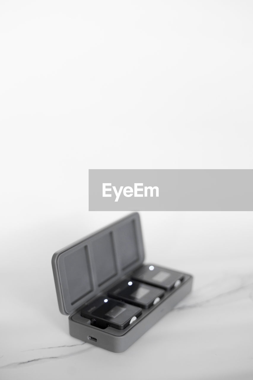 high angle view of empty chair against white background