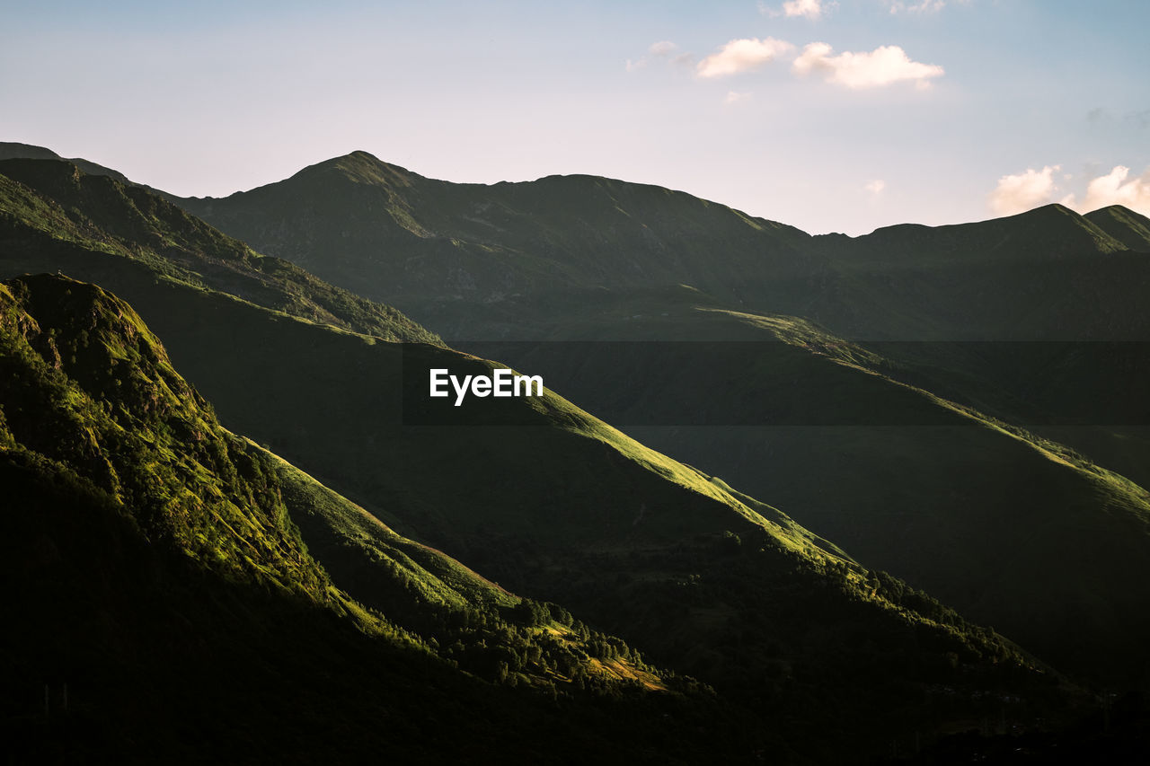 Layers of mountains in sunset light near lake como / lago di como, italy