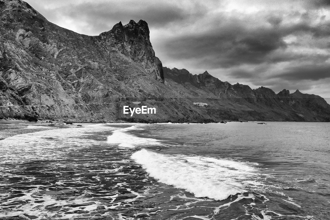 Scenic view of sea against cloudy sky