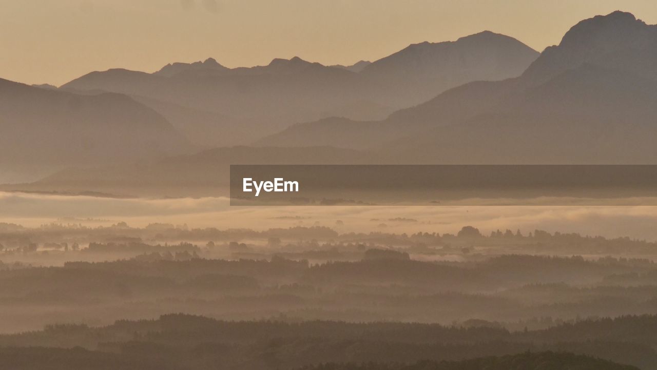 Scenic view of mountains against sky during sunset