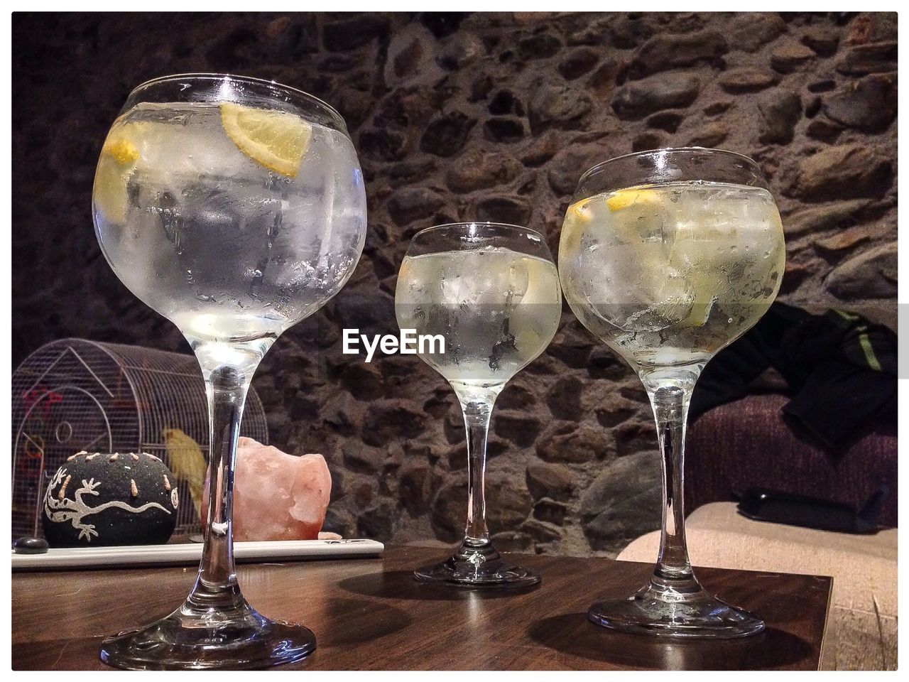 CLOSE-UP OF WINE GLASSES ON TABLE