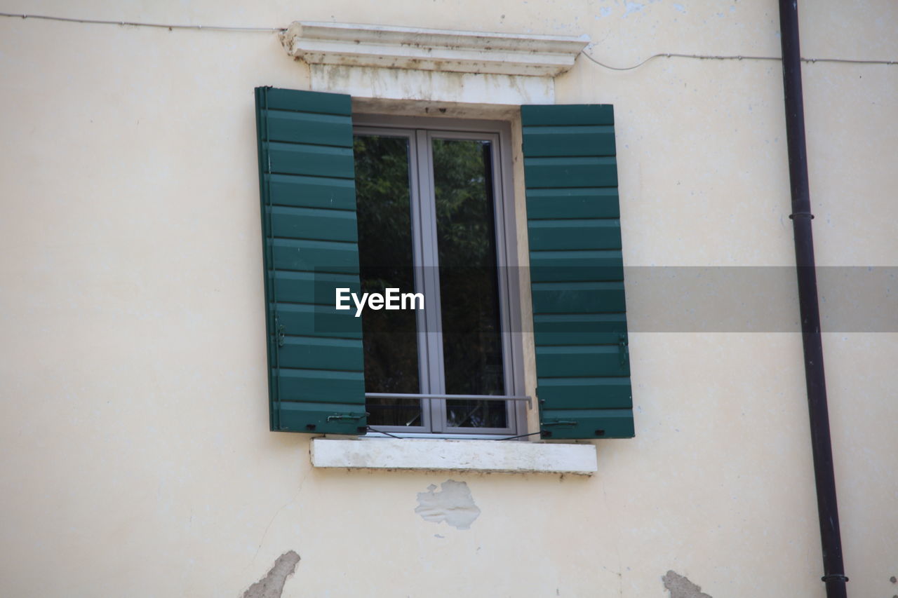 architecture, window, wall, building exterior, blue, built structure, building, house, no people, window covering, interior design, wall - building feature, facade, day, home, residential district, outdoors, balcony, wood, sash window