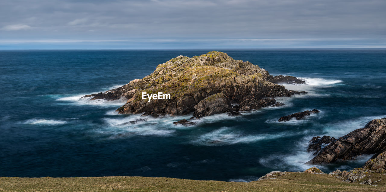 The small island of garbh-eilean near strathy point on the north coast of scotland
