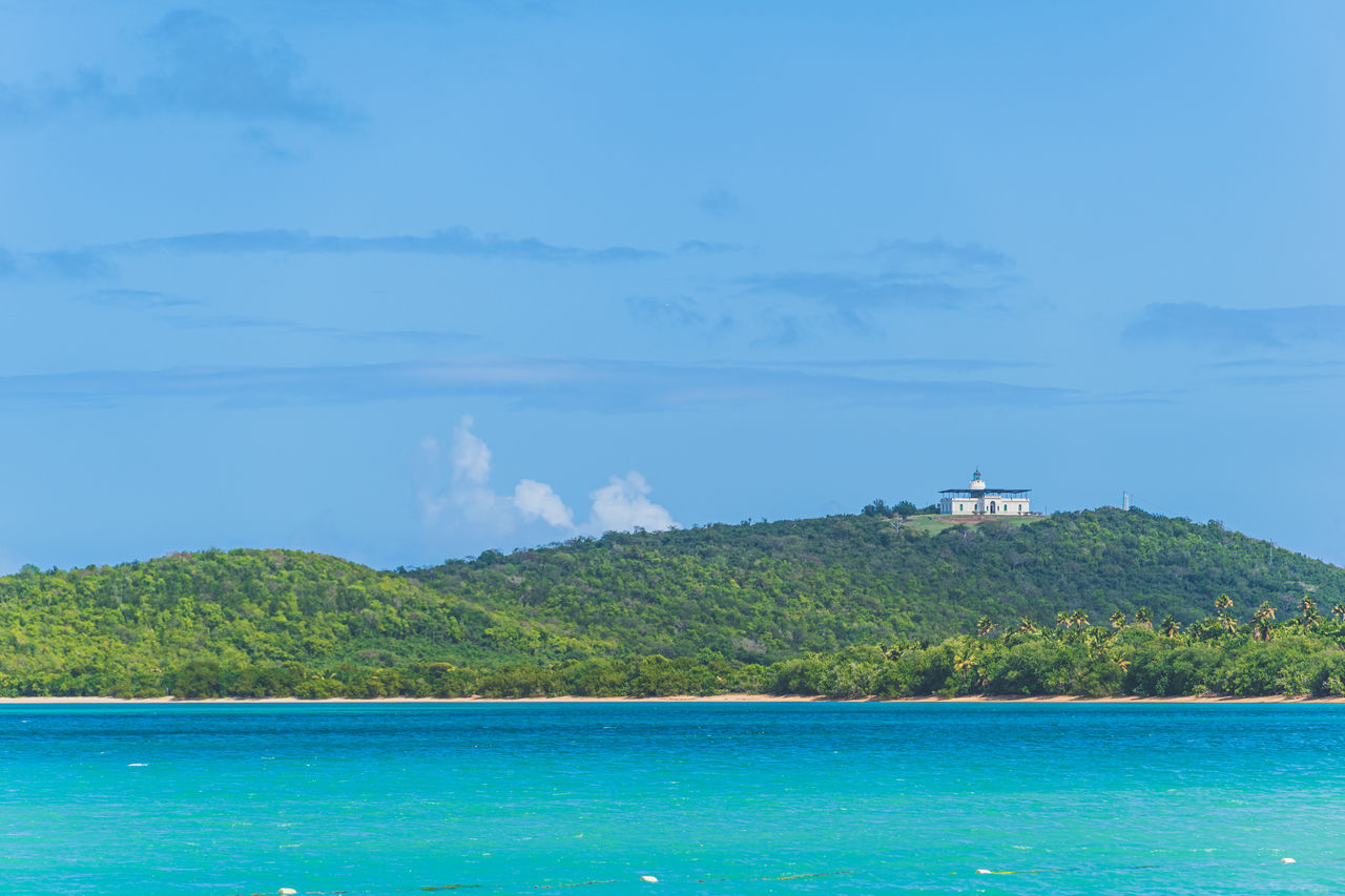 SCENIC VIEW OF SEA BY MOUNTAINS AGAINST SKY