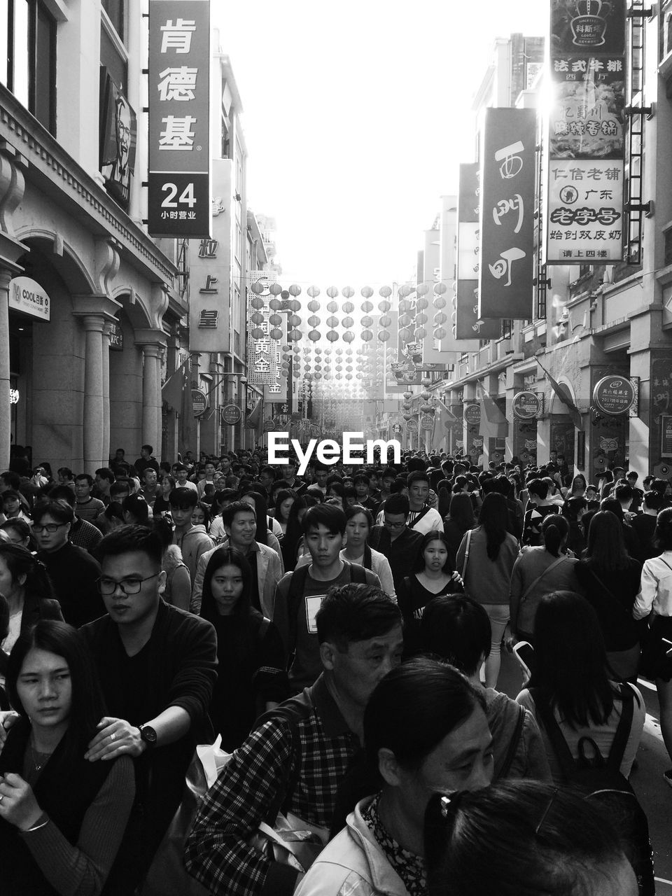 CROWD ON STREET IN CITY