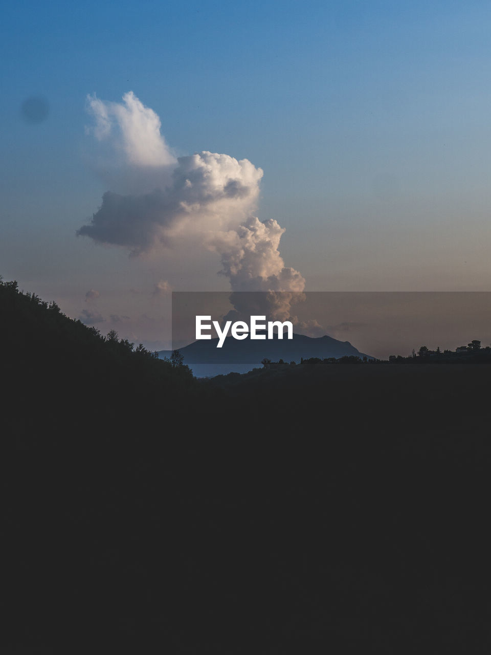 Scenic view of silhouette mountains against sky during sunset