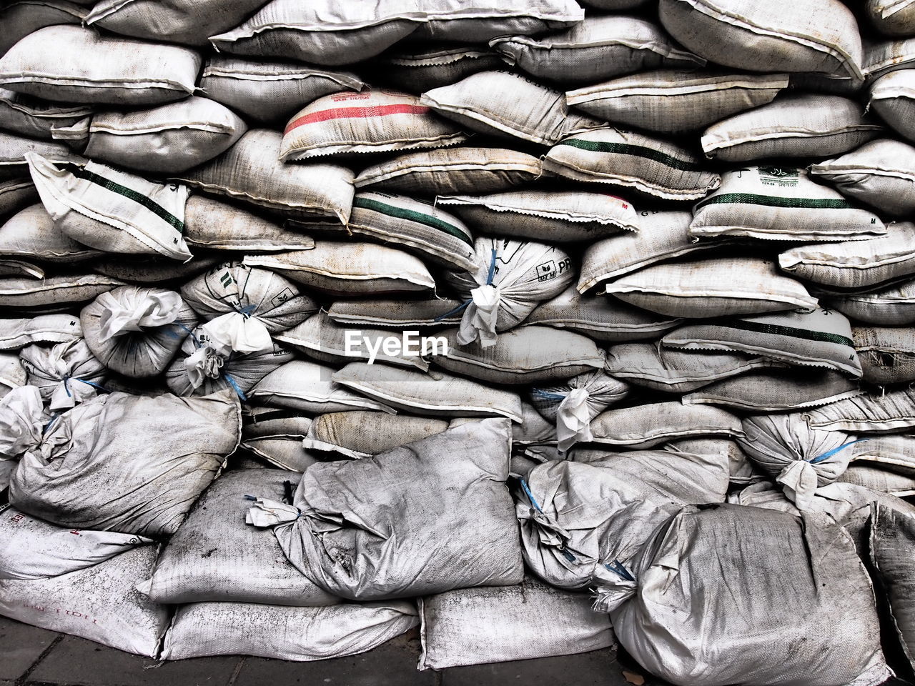 Stack of sack arranged in warehouse