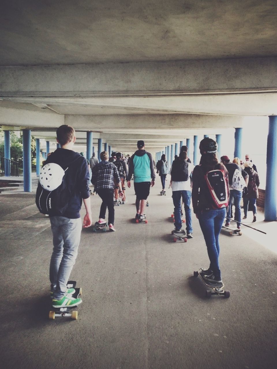 Group of people skateboarding on the street