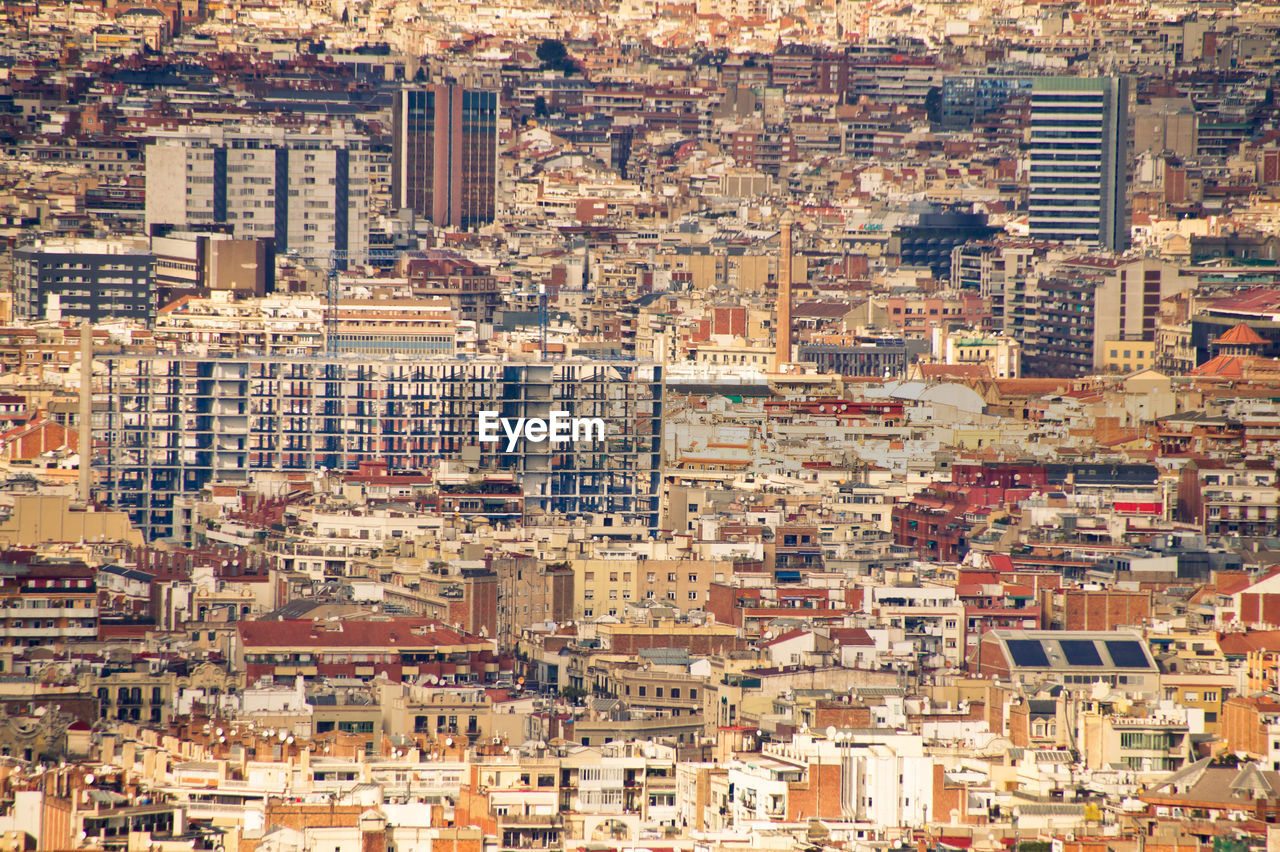 High angle view of buildings in city at sunset