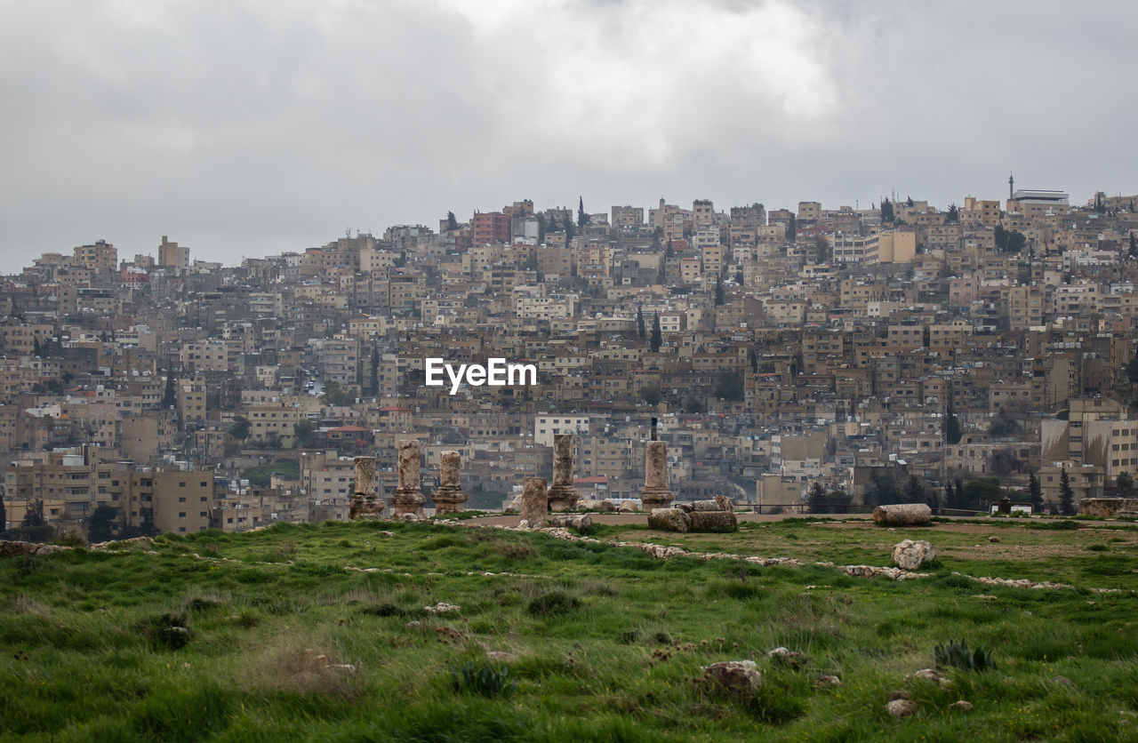 Buildings in city against sky