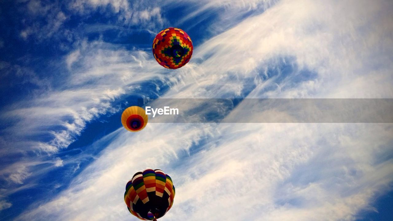 Hot air balloons gliding effortlessly through the wind 