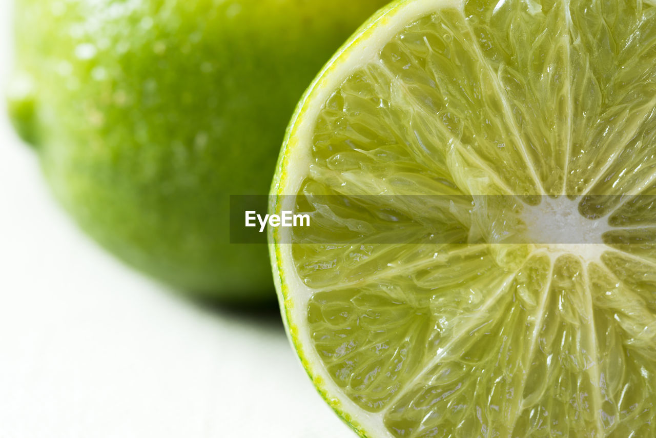 Close-up of lemon slice against white background