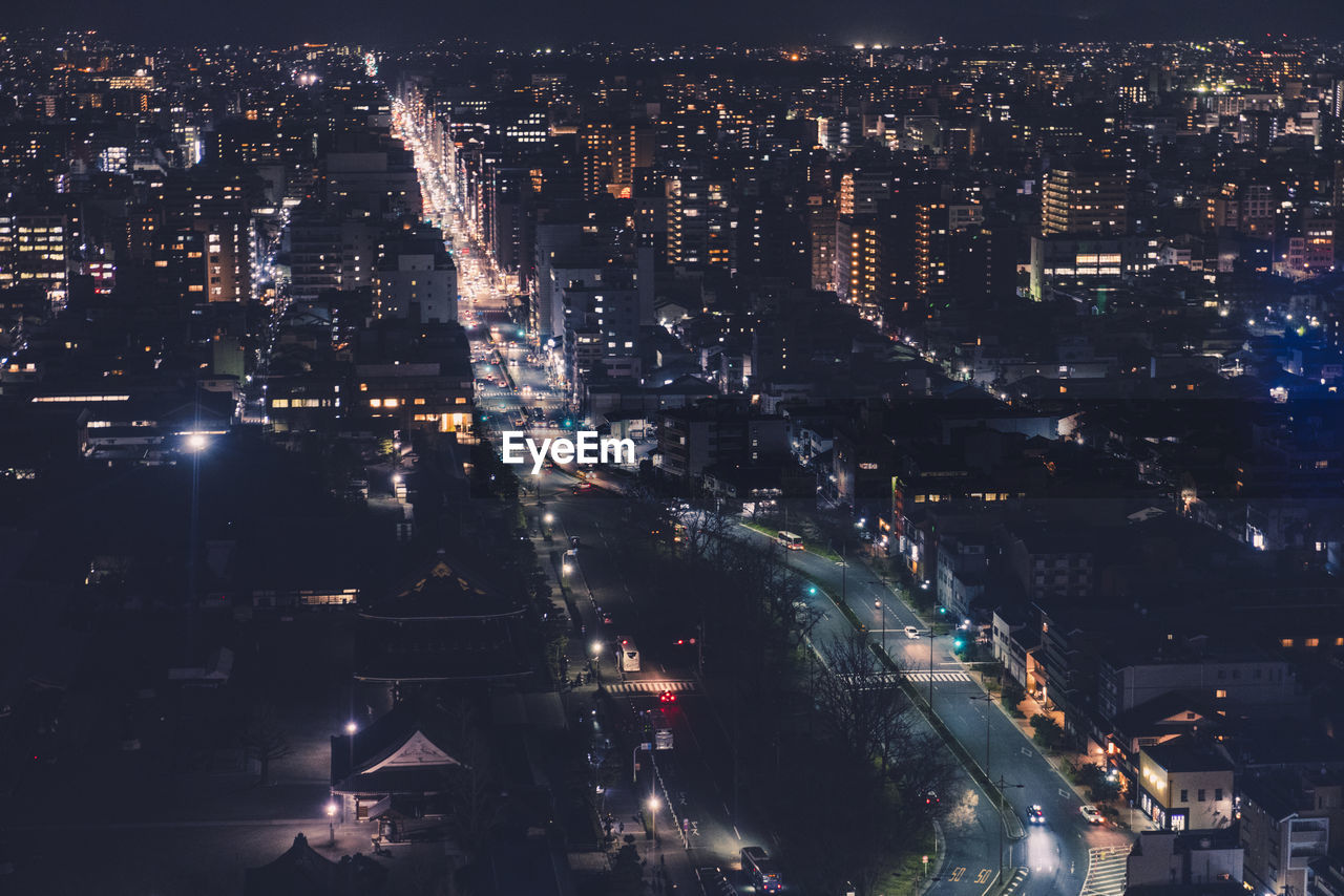 High angle view of illuminated city buildings at night