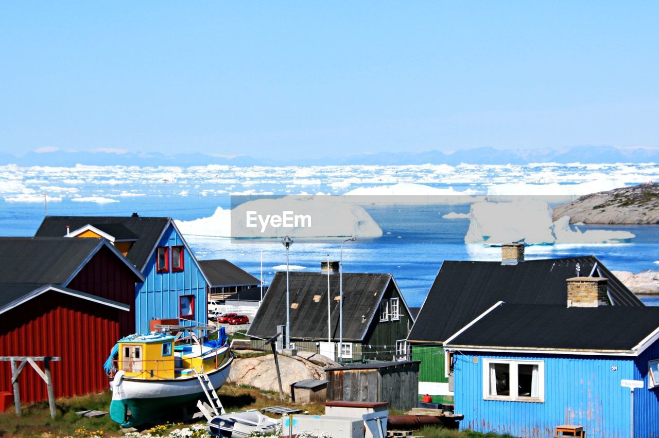 High angle view of houses by sea