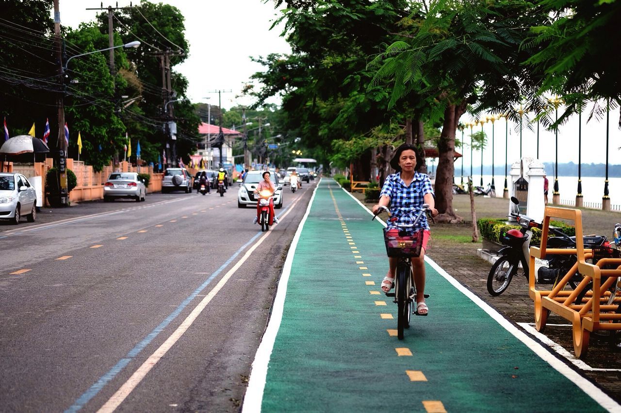 WOMAN WALKING ON ROAD