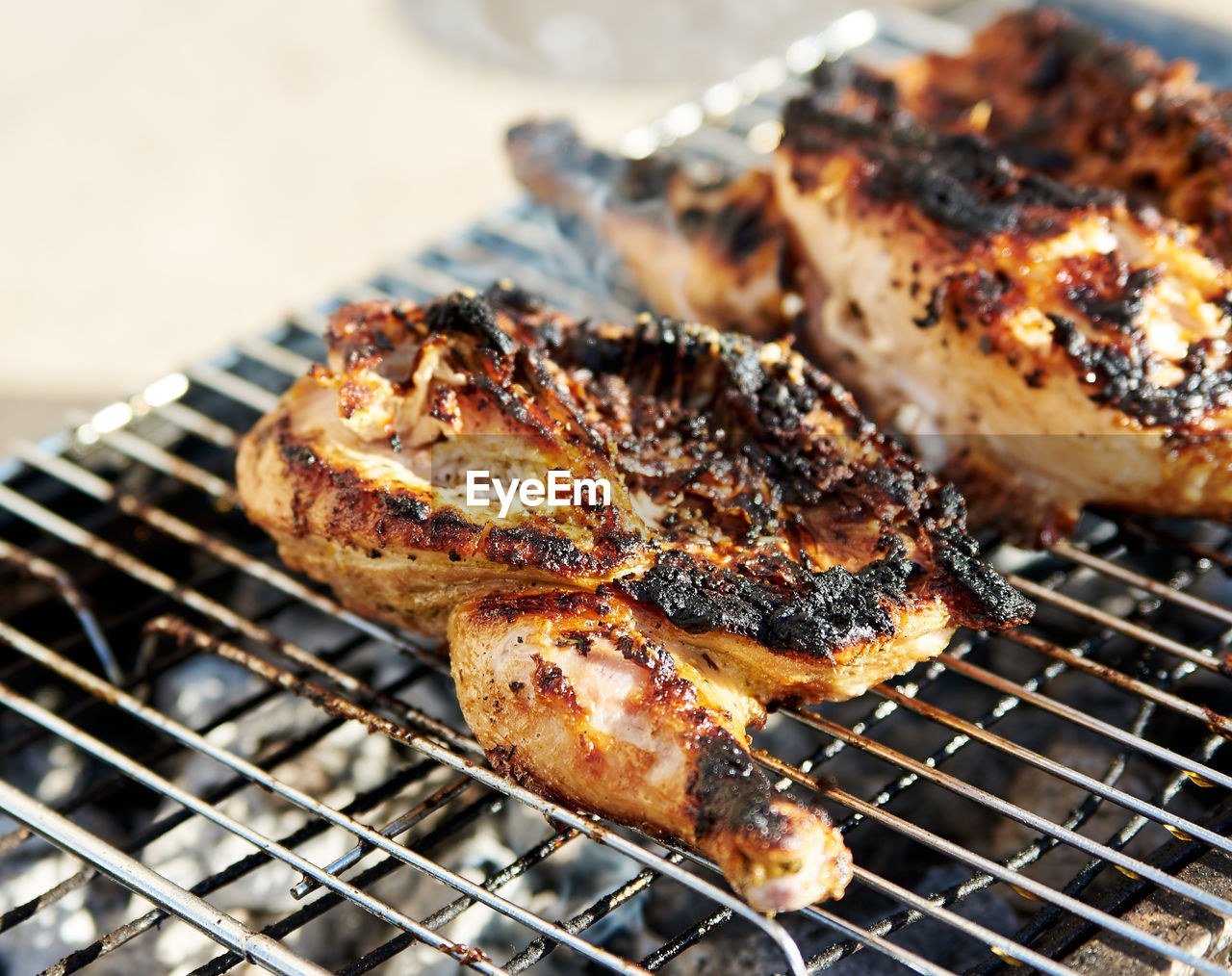 Close-up of chicken meat on barbecue grill