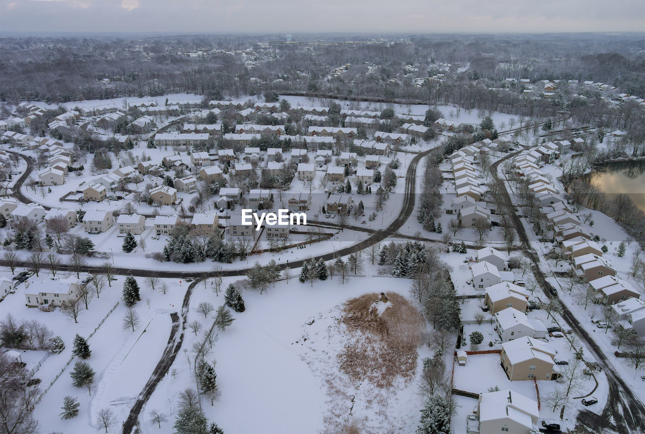 HIGH ANGLE VIEW OF CITYSCAPE DURING WINTER SEASON