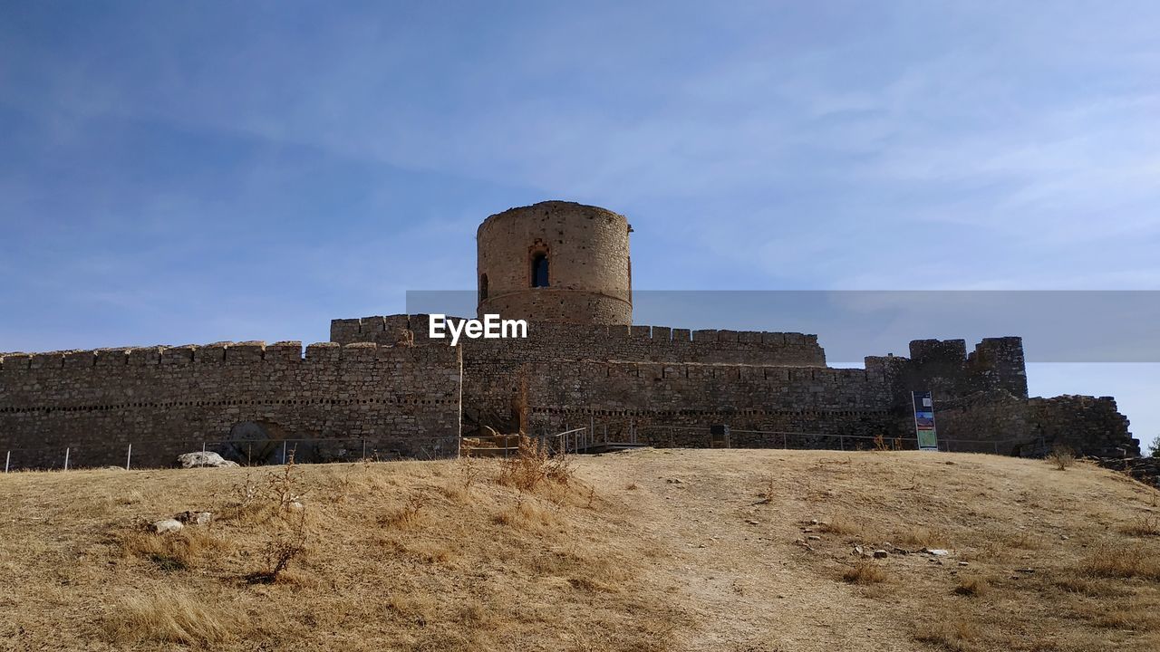 Low angle view of old ruin building against sky