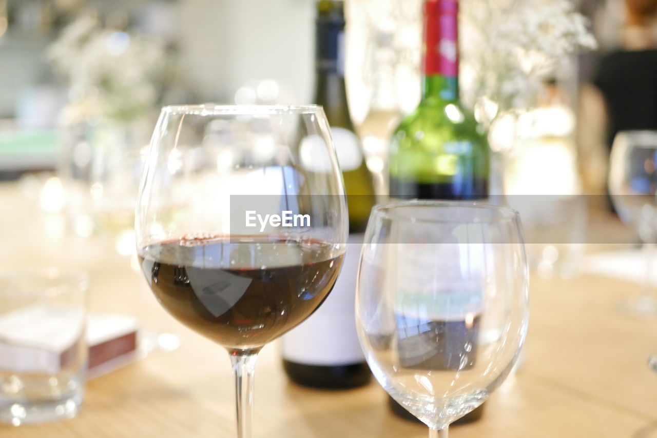 Close-up of wineglass on table at home