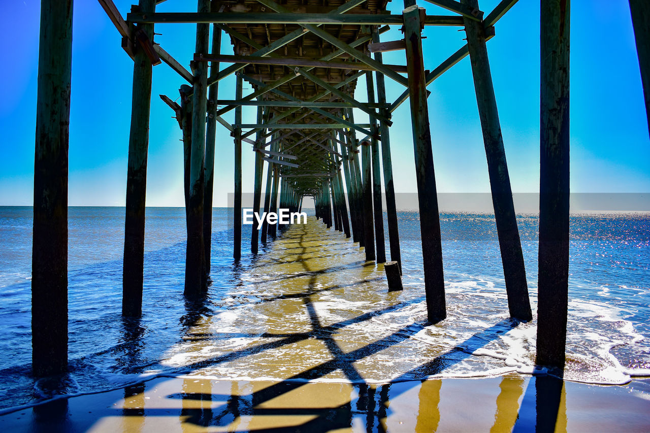 View of pier over sea against sky