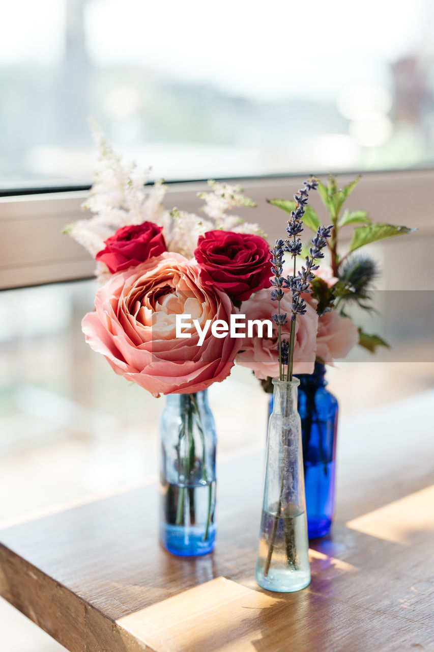 Close-up of rose in vase on table