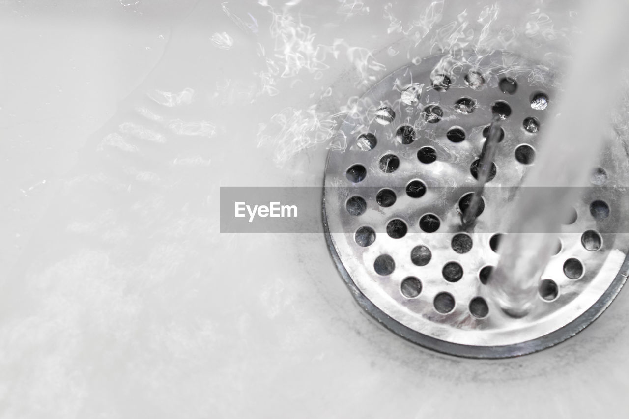 High angle view of water falling in sink