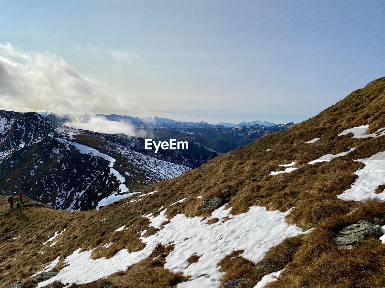 SCENIC VIEW OF MOUNTAINS AGAINST SKY DURING WINTER