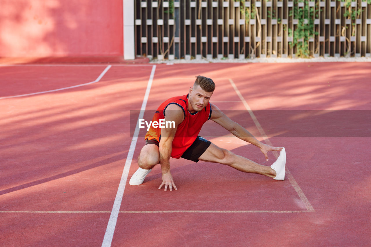 MAN RUNNING ON SKATEBOARD