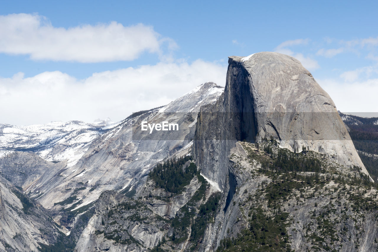 Low angle view of rocky mountains against sky