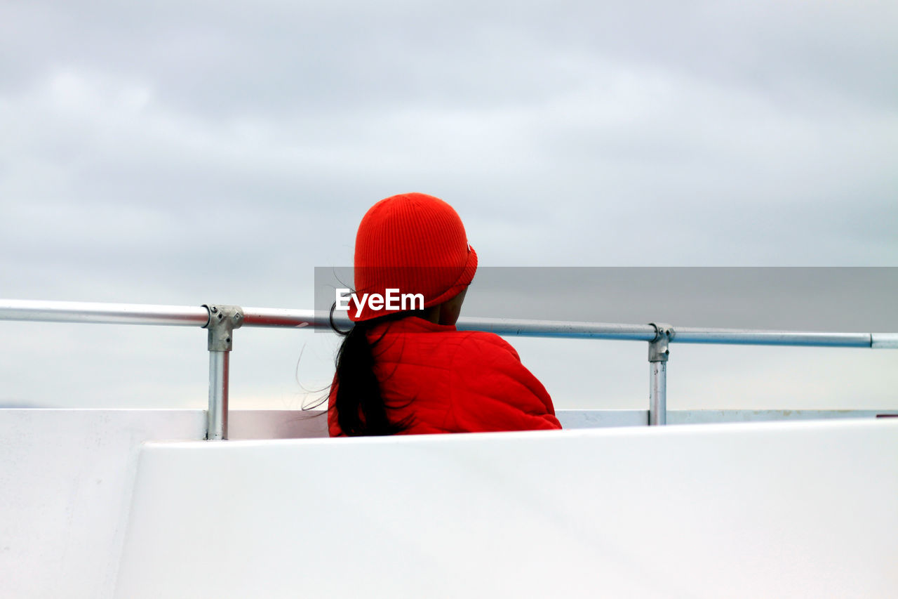 Rear view of woman on boat deck