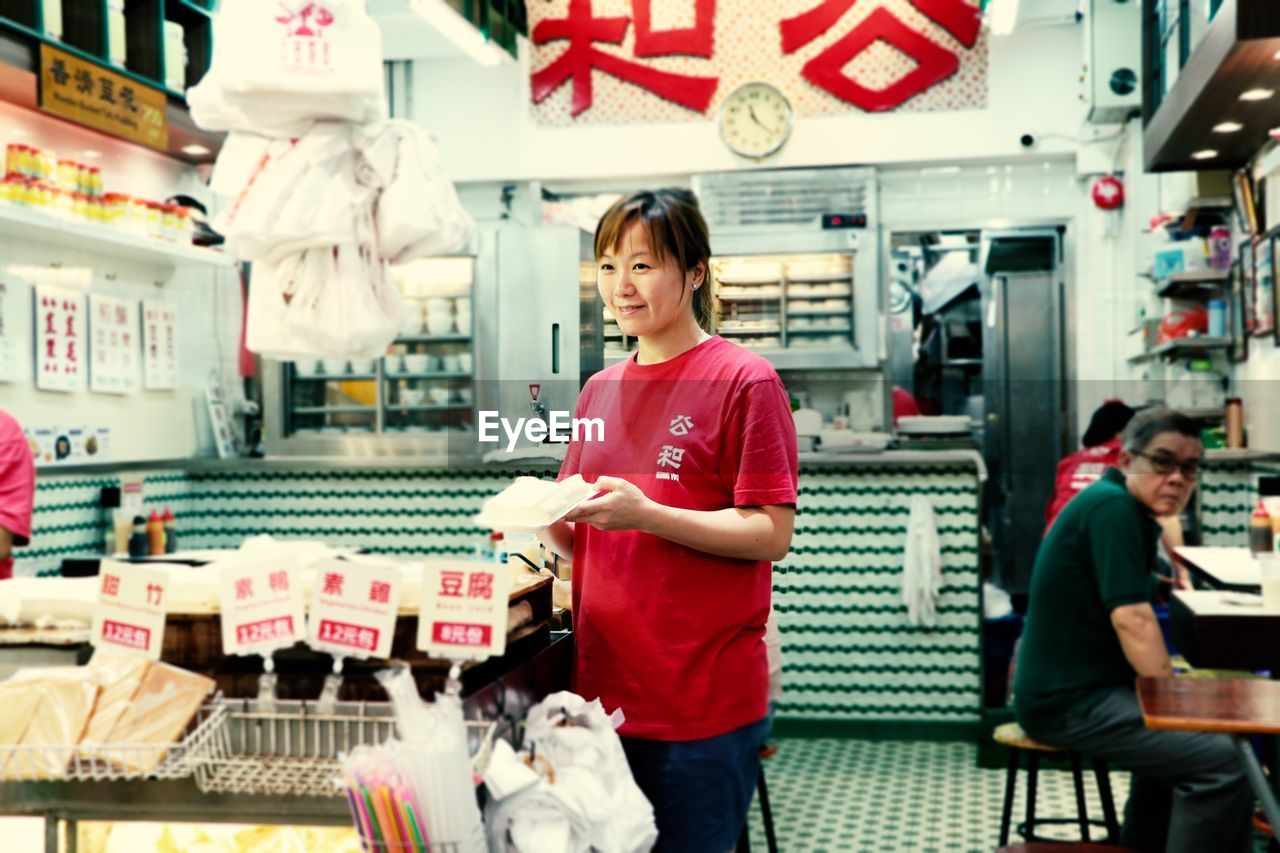 Waitress standing at restaurant