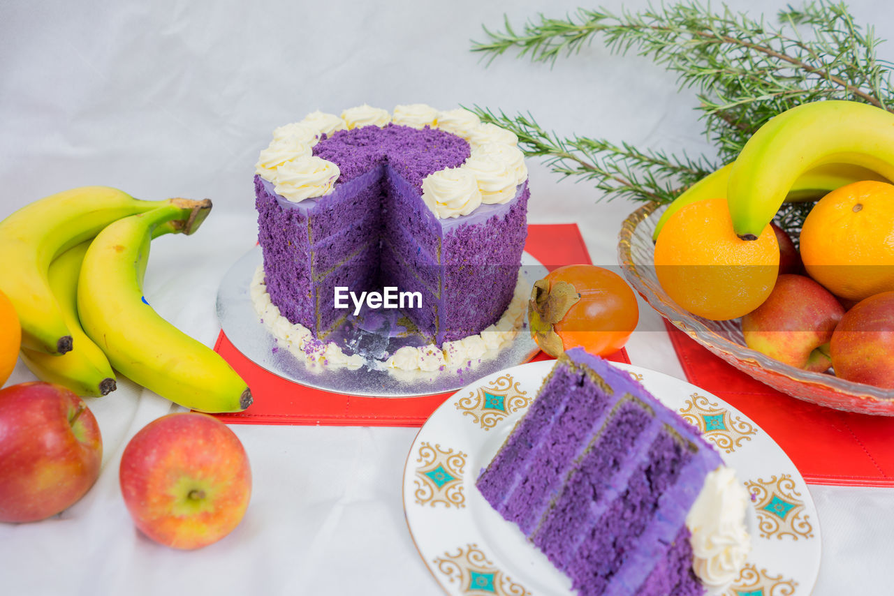 Close-up of cake and fruits on table during christmas